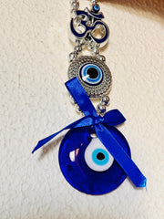 🔱 Divine Protection Combo – Golden Trishool-Damroo with Om & Rudraksha Idol + 🧿 Om Evil Eye Wall Hanging